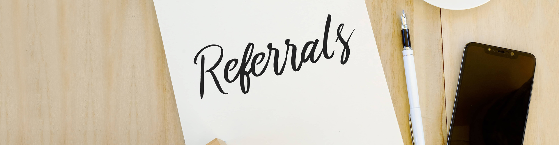 Referrals word written on a notepad